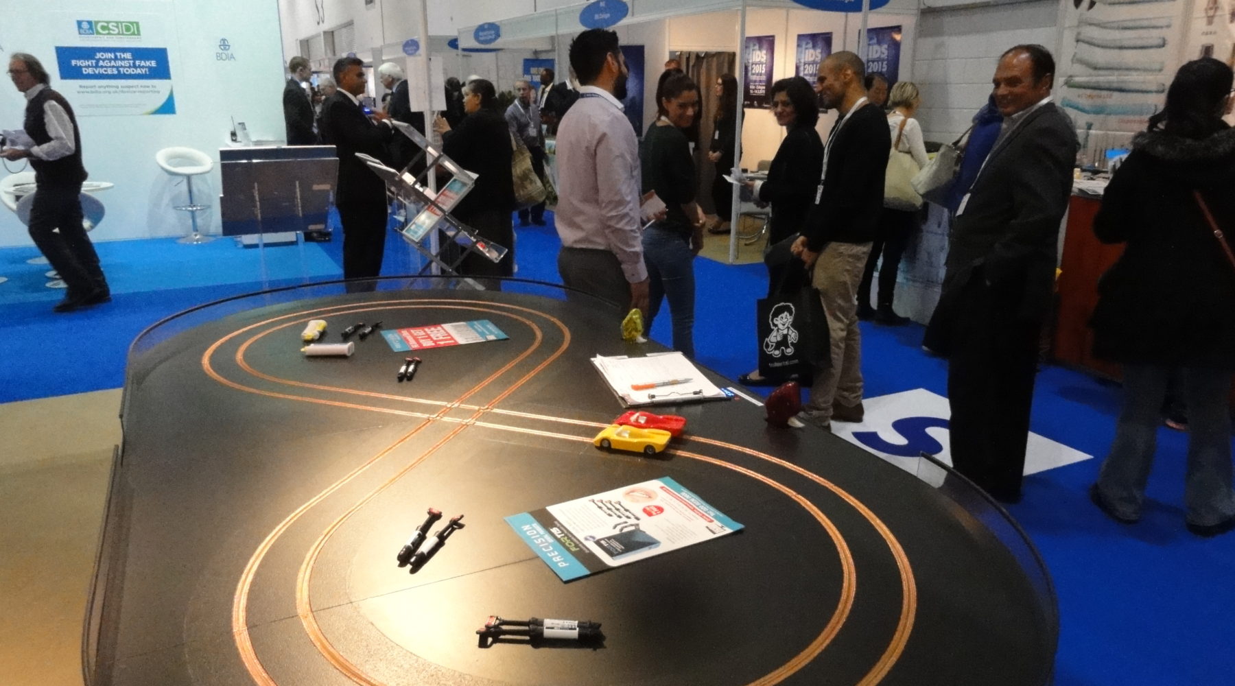 Miniracing Scaelxtric 2 lane track with custom branding on an exhibition stand